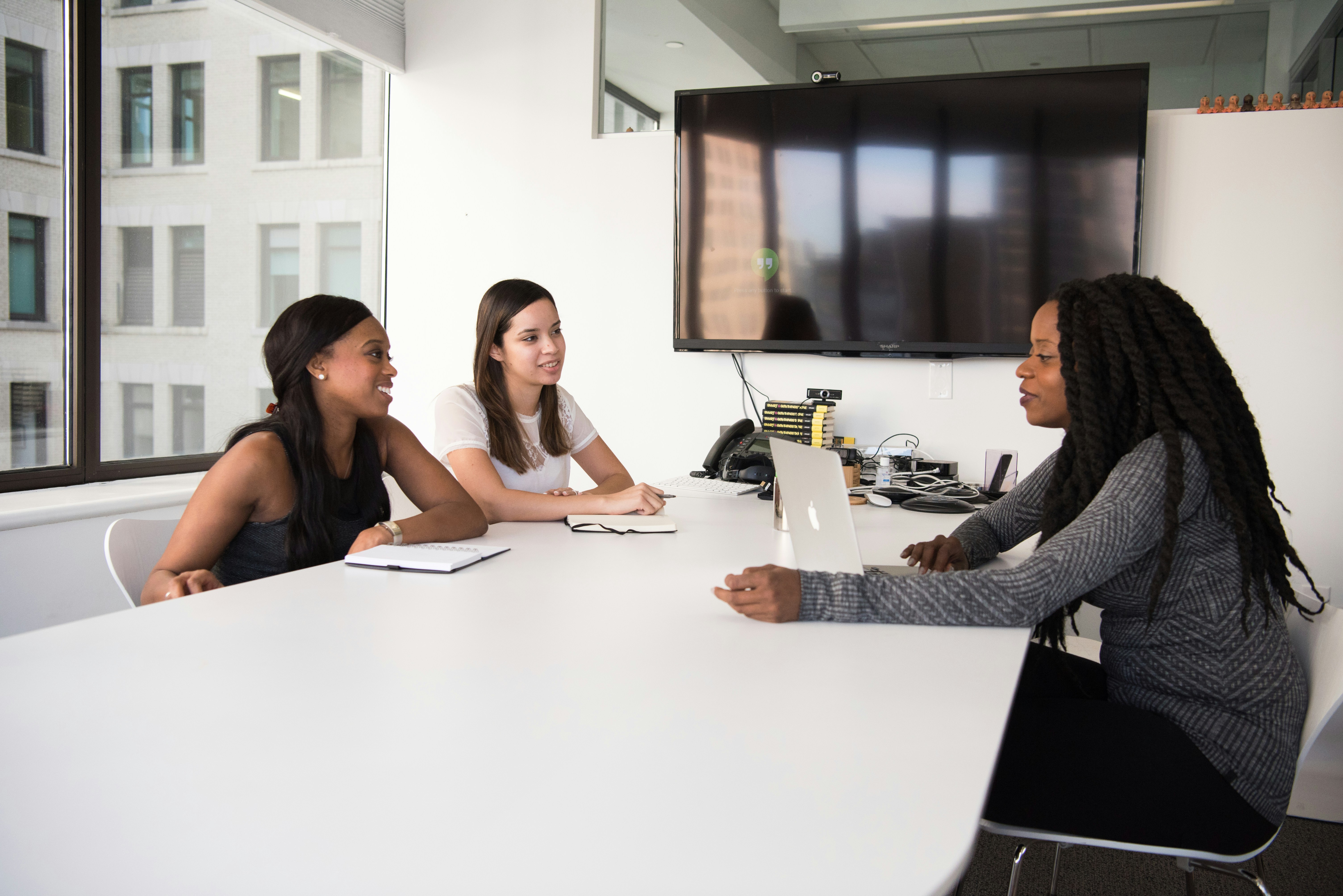 Three women having a meeting